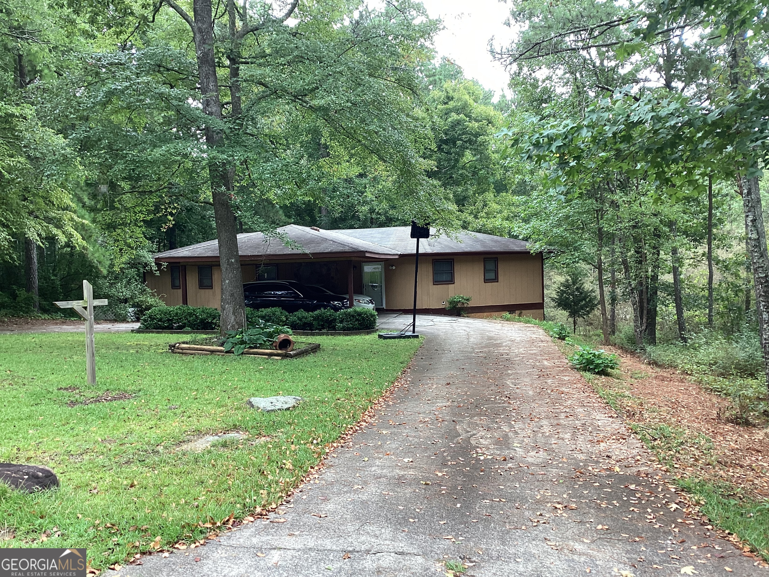1497 Stonington Court Villa Rica, GA 30180 - Photo 10 of 10 a front view of a house with a yard and a tree