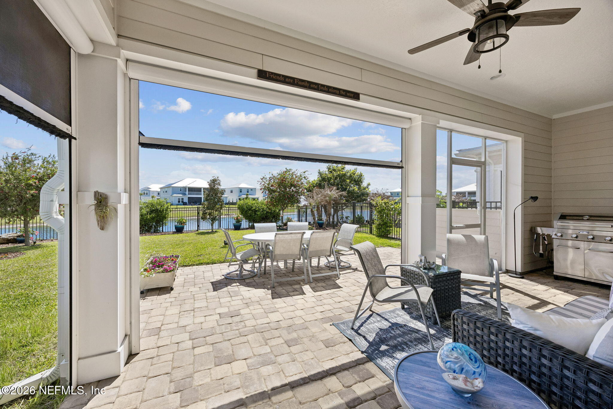 662 Rum Runner Way St. Johns, FL 32259 - Photo 10 of 79 a living room with furniture and a floor to ceiling window