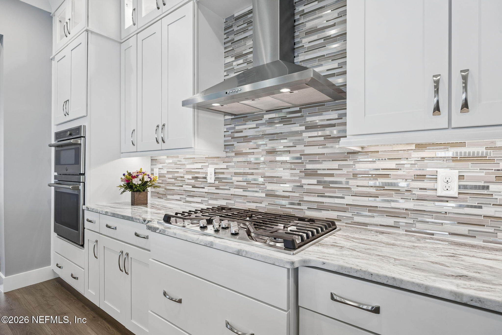 662 Rum Runner Way St. Johns, FL 32259 - Photo 17 of 79 a kitchen with white cabinets and appliances