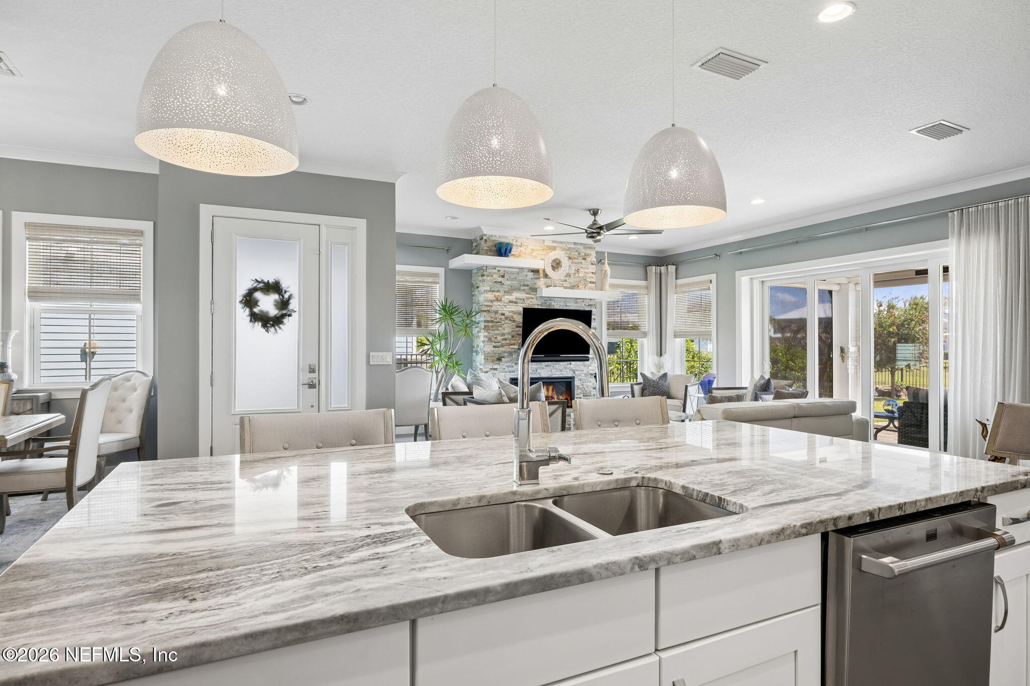 662 Rum Runner Way St. Johns, FL 32259 - Photo 18 of 79 a kitchen with a sink and a large mirror with cabinets