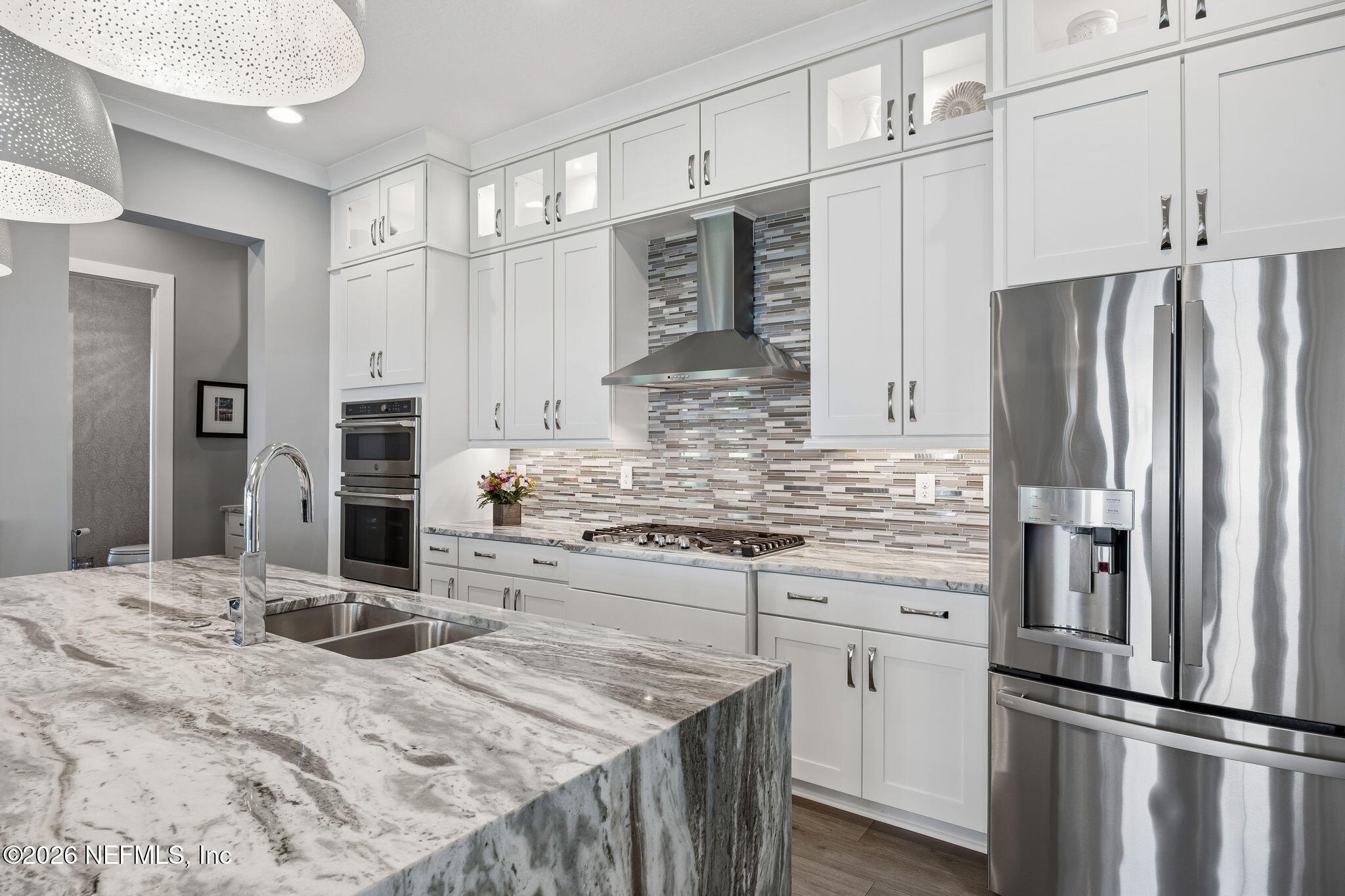 662 Rum Runner Way St. Johns, FL 32259 - Photo 19 of 79 a kitchen with kitchen island granite countertop appliances cabinets and counter space