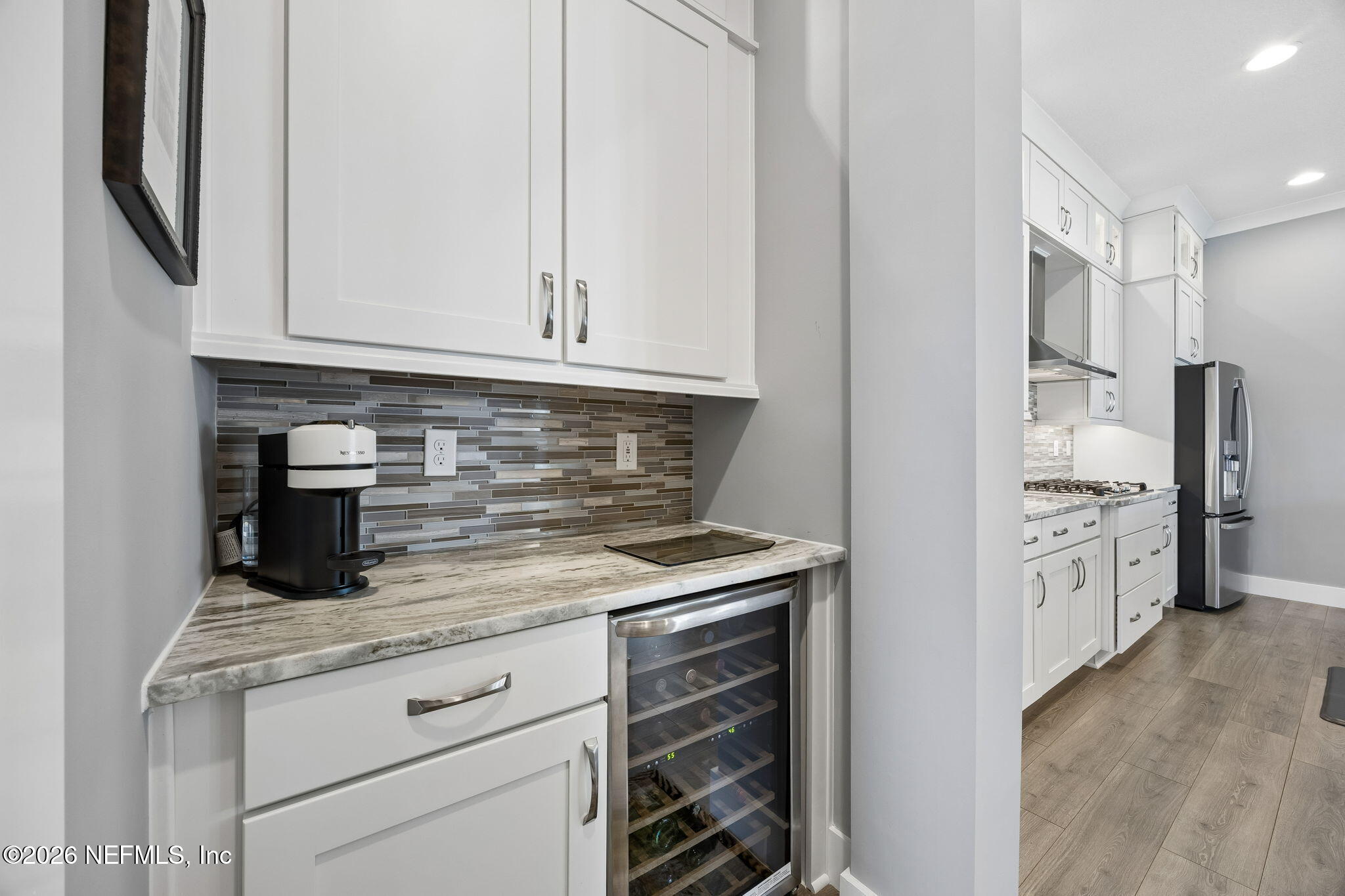 662 Rum Runner Way St. Johns, FL 32259 - Photo 20 of 79 a kitchen with stainless steel appliances granite countertop a stove and a refrigerator