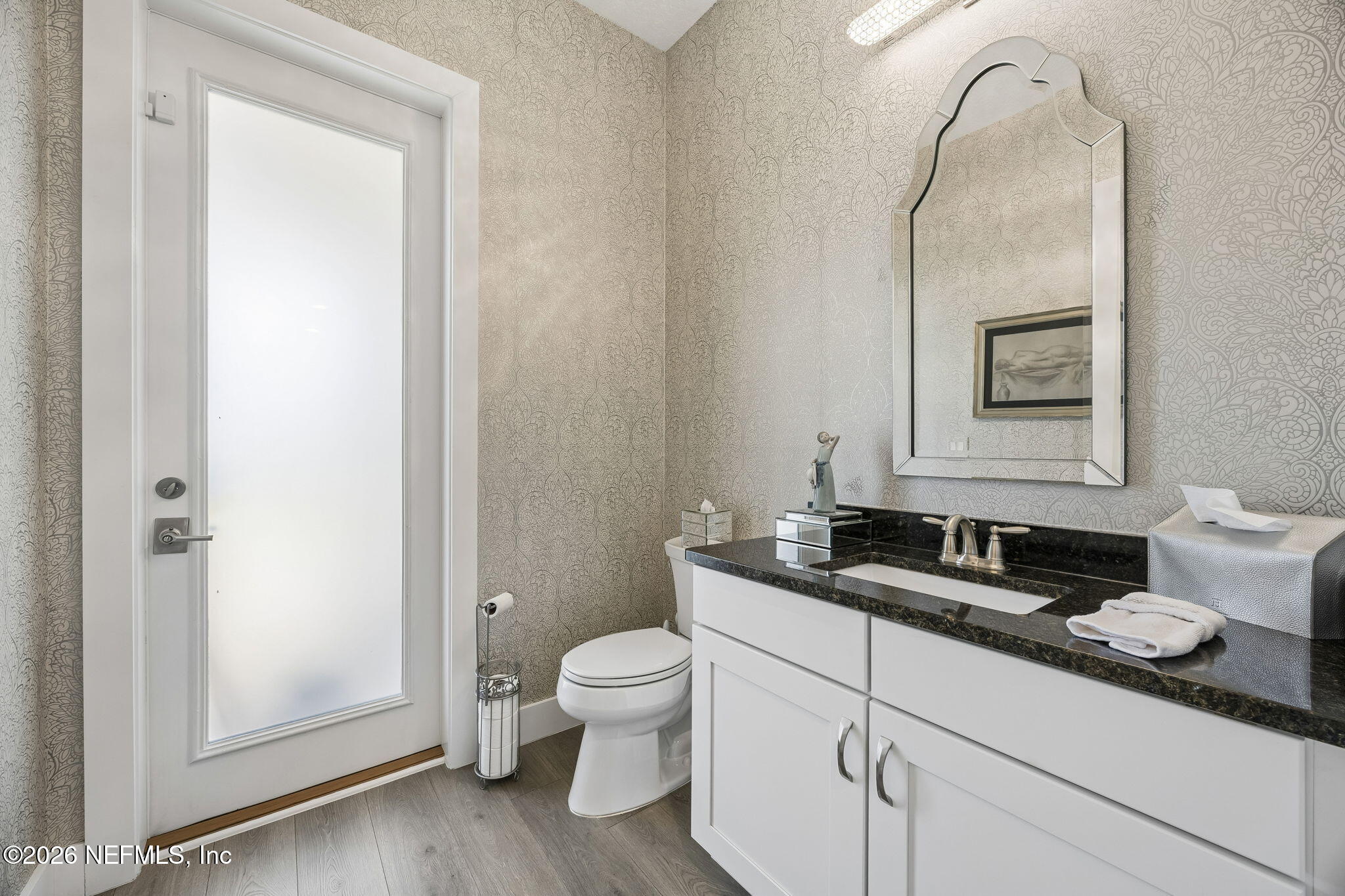 662 Rum Runner Way St. Johns, FL 32259 - Photo 21 of 79 a bathroom with a toilet sink and mirror