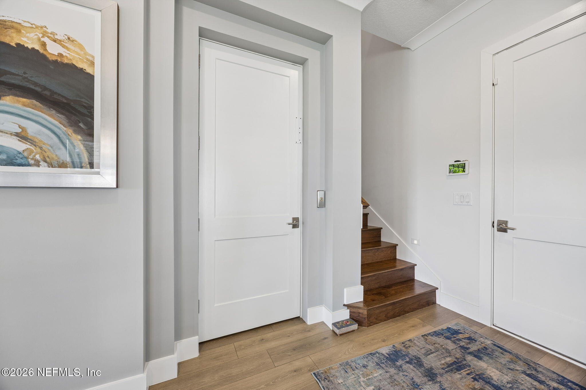 662 Rum Runner Way St. Johns, FL 32259 - Photo 22 of 79 a view of an entryway with wooden floor and staircase