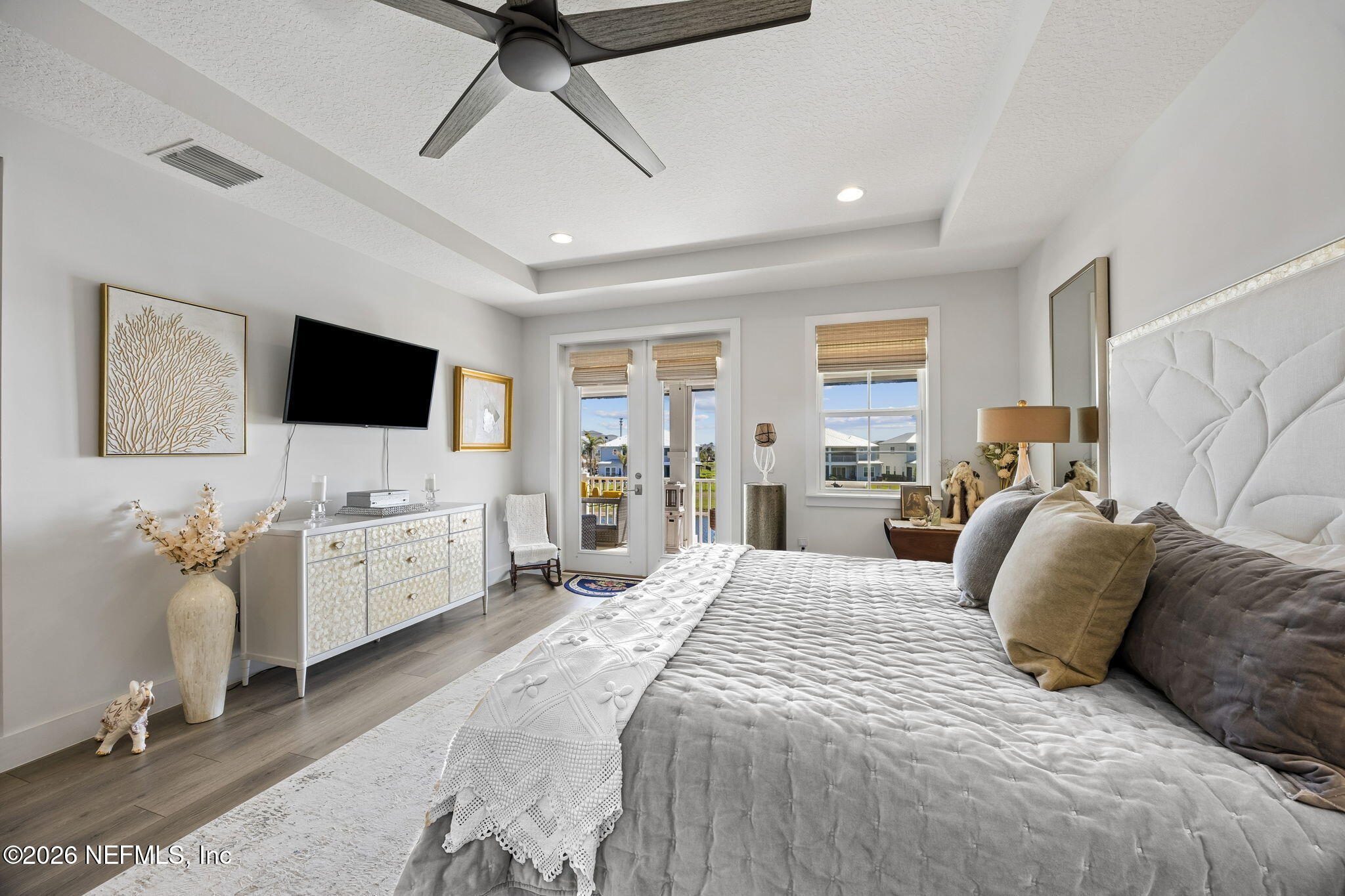 662 Rum Runner Way St. Johns, FL 32259 - Photo 27 of 79 a view of a bedroom with furniture and flat screen tv