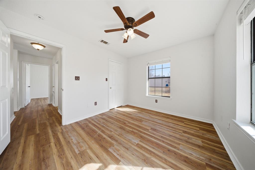 697 County Road 166 Whitesboro, TX 76273 - Photo 20 of 32 a view of empty room with wooden floor