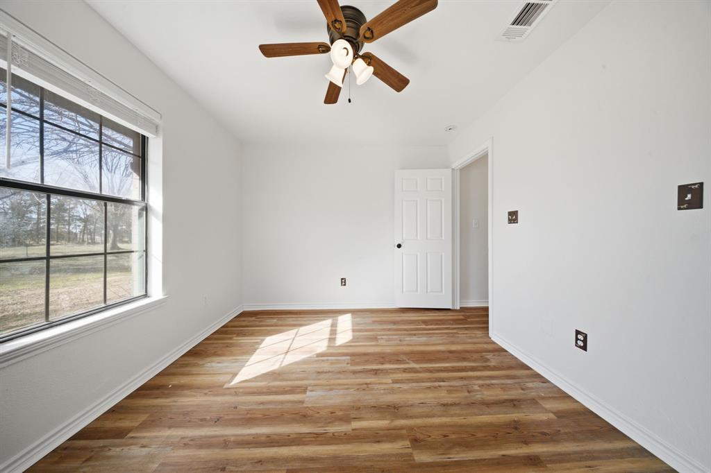 697 County Road 166 Whitesboro, TX 76273 - Photo 21 of 32 a view of an empty room with a window