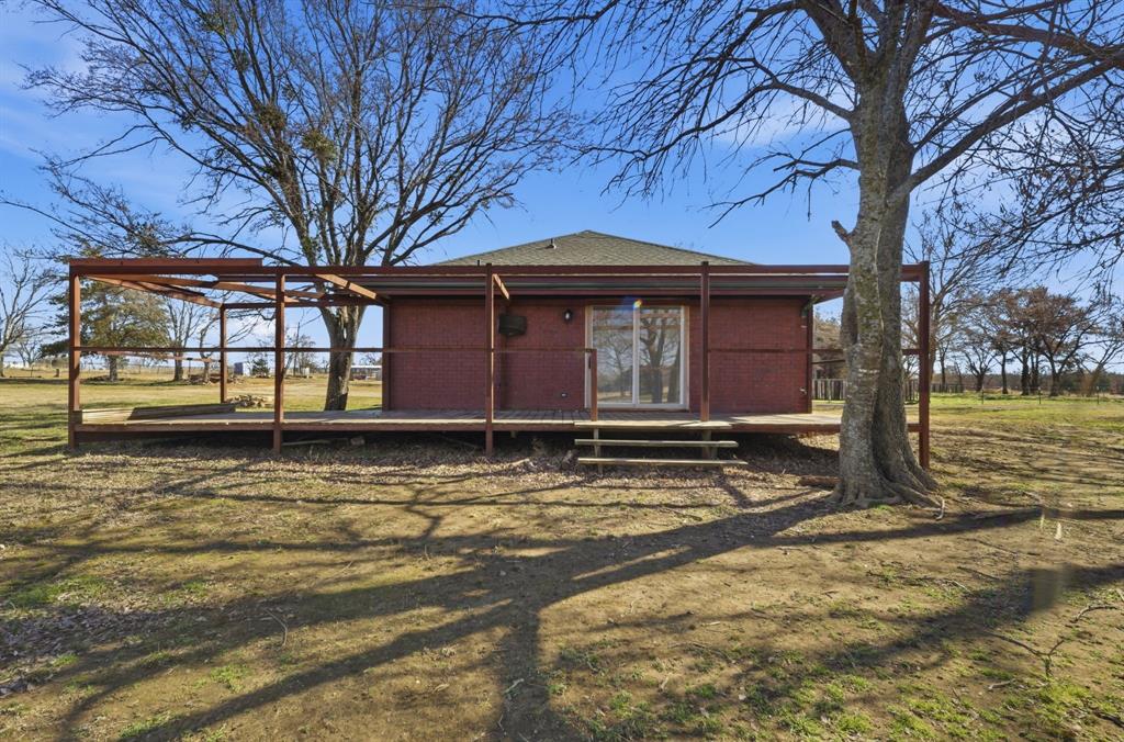697 County Road 166 Whitesboro, TX 76273 - Photo 22 of 32 a front view of a house with a yard