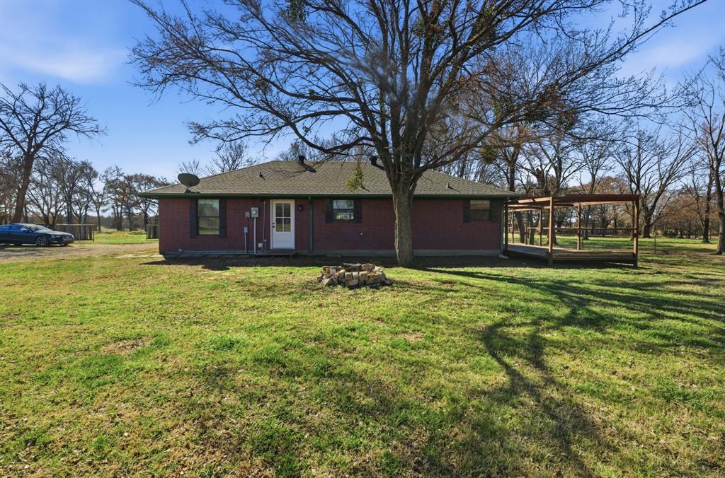 697 County Road 166 Whitesboro, TX 76273 - Photo 23 of 32 a view of a house with a yard