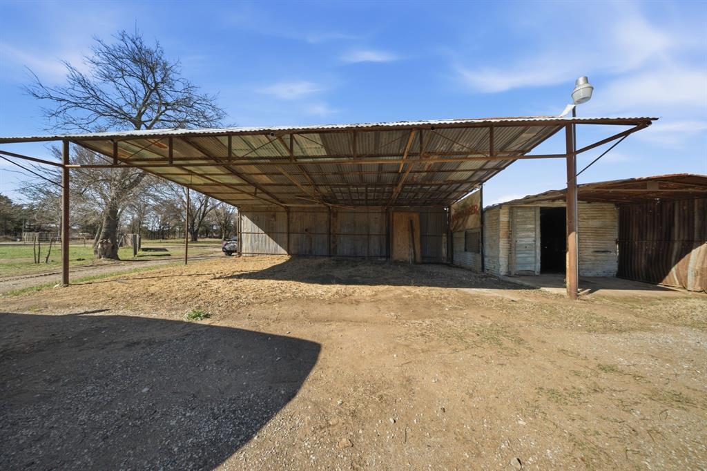 697 County Road 166 Whitesboro, TX 76273 - Photo 26 of 32 a view of a backyard of a house
