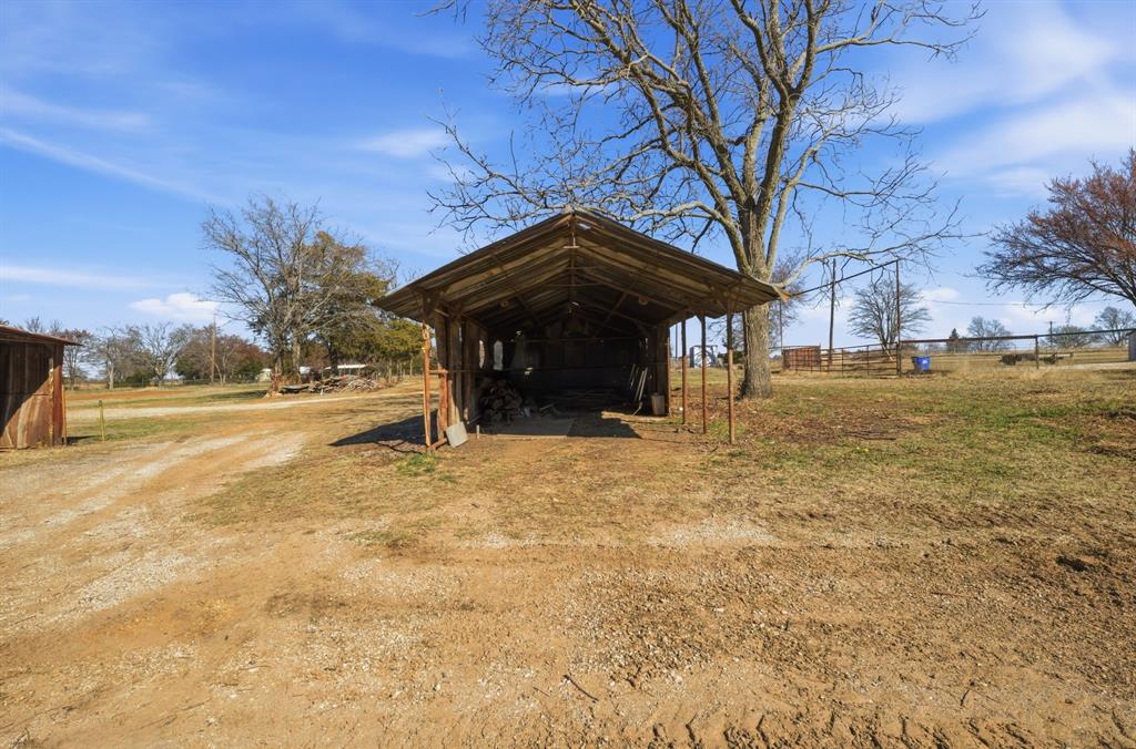 697 County Road 166 Whitesboro, TX 76273 - Photo 27 of 32 a view of patio with a yard