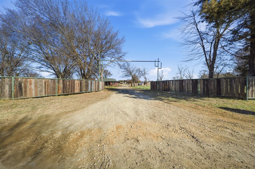 697 County Road 166 Whitesboro, TX 76273 - Photo 29 of 32 a view of a yard with wooden fence