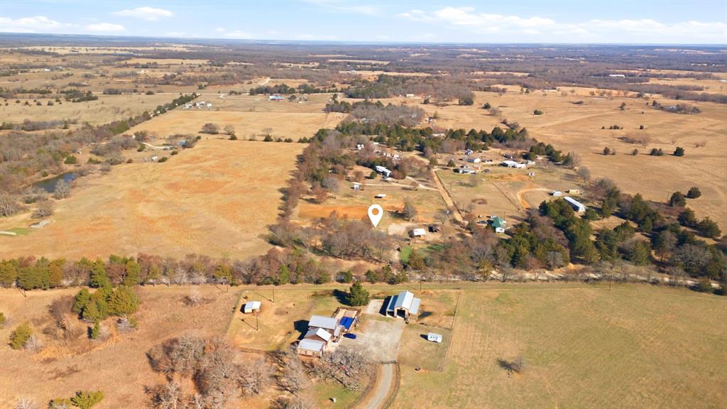 697 County Road 166 Whitesboro, TX 76273 - Photo 30 of 32 an aerial view of ocean and residential houses with outdoor space