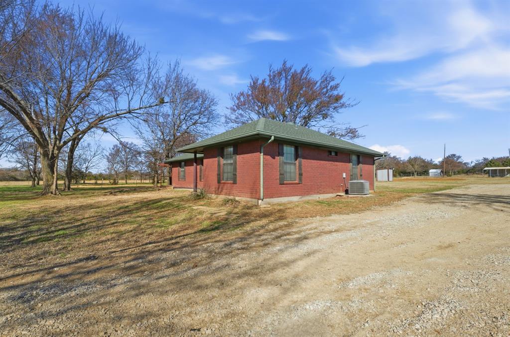 697 County Road 166 Whitesboro, TX 76273 - Photo 3 of 32 a view of swimming pool of the house with green space
