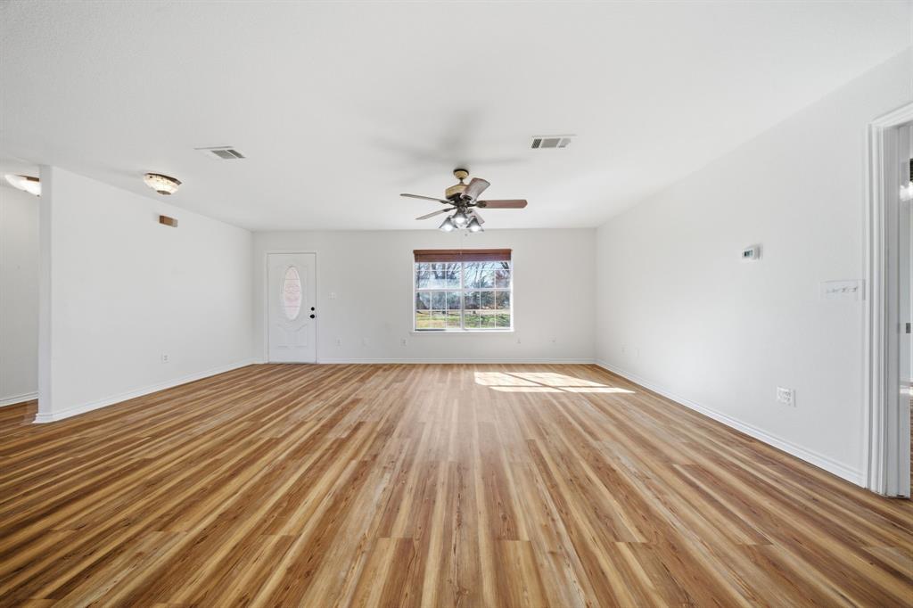 697 County Road 166 Whitesboro, TX 76273 - Photo 4 of 32 wooden floor in an empty room