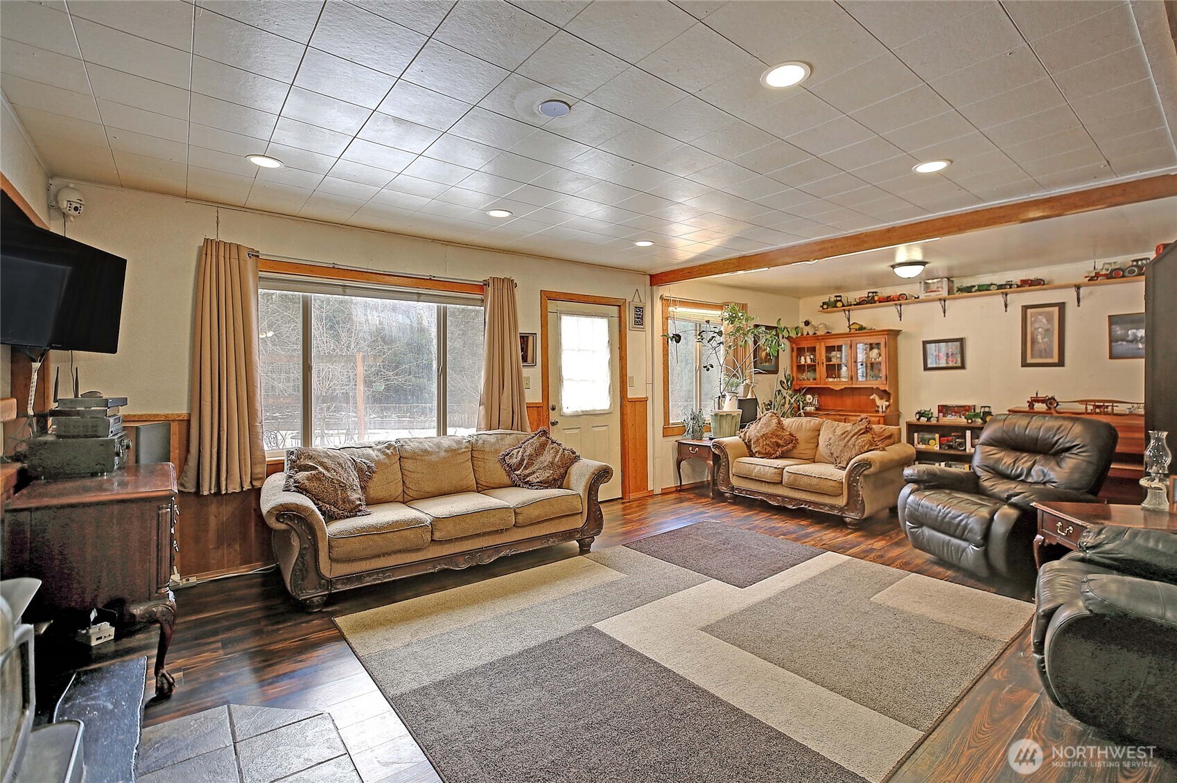 39729 State Rte 530 Northeast Arlington, WA 98223 - Photo 12 of 40 a living room with furniture ceiling fan and a window