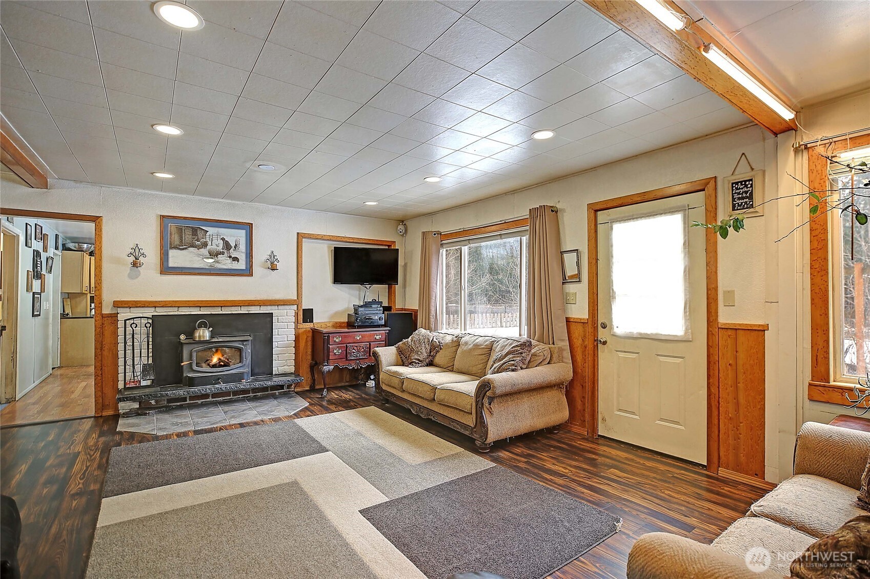 39729 State Rte 530 Northeast Arlington, WA 98223 - Photo 13 of 40 a living room with furniture large window and a fireplace