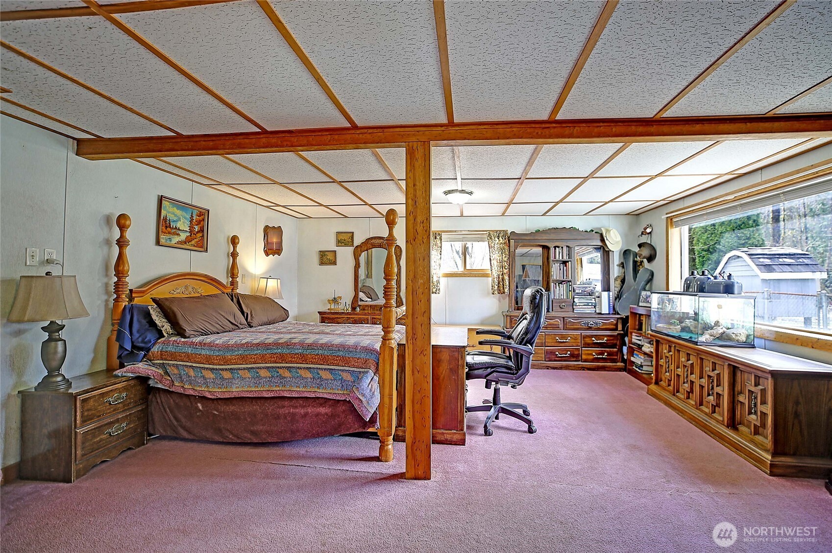 39729 State Rte 530 Northeast Arlington, WA 98223 - Photo 15 of 40 a bedroom with furniture and a large window