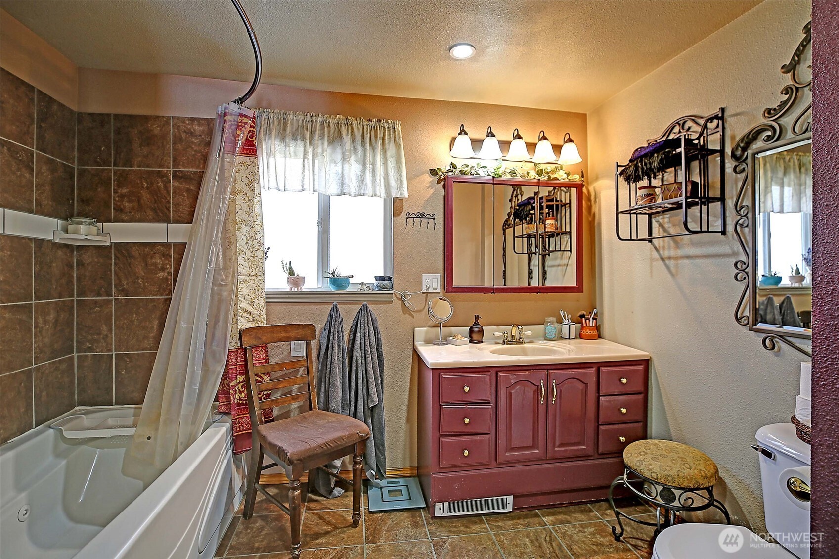 39729 State Rte 530 Northeast Arlington, WA 98223 - Photo 16 of 40 a bathroom with a tub sink and mirror