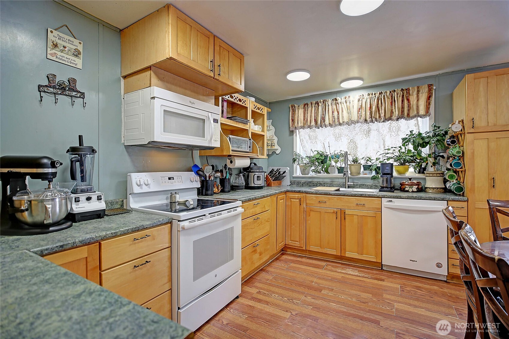 39729 State Rte 530 Northeast Arlington, WA 98223 - Photo 6 of 40 a kitchen with stainless steel appliances granite countertop a stove a sink and a refrigerator