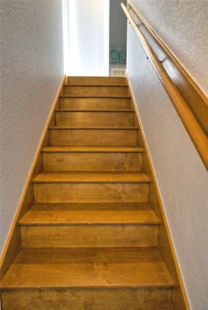 a bedroom with a bed and a television