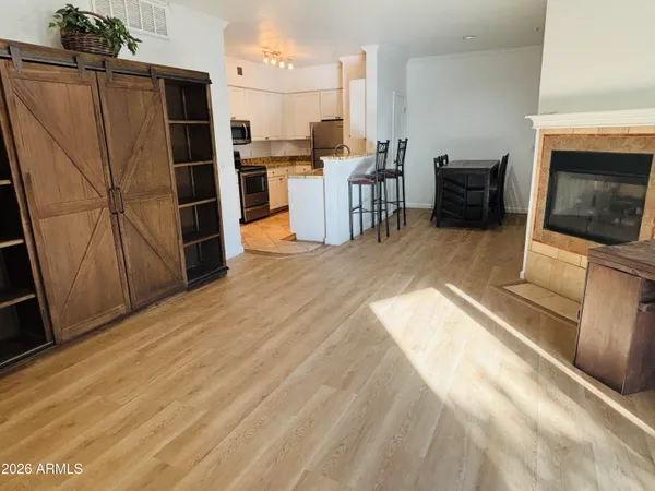 a kitchen with stainless steel appliances a refrigerator and a stove top oven