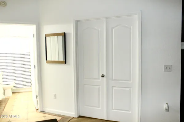 a view of a bathroom with a shower and a door