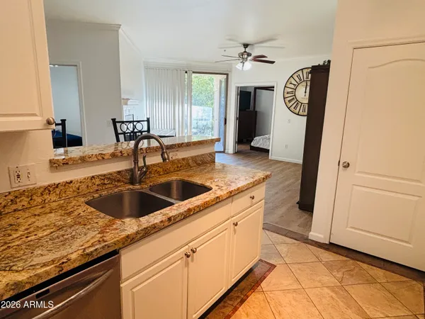 a kitchen with a sink and a refrigerator