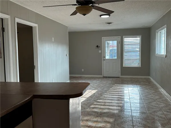 a view of an empty room and window