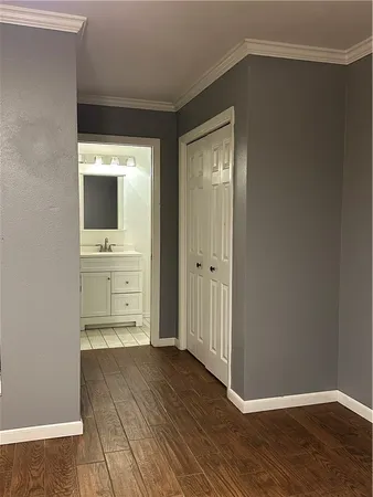 a view of a kitchen from the hallway