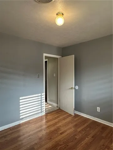 a view of a livingroom with wooden floor