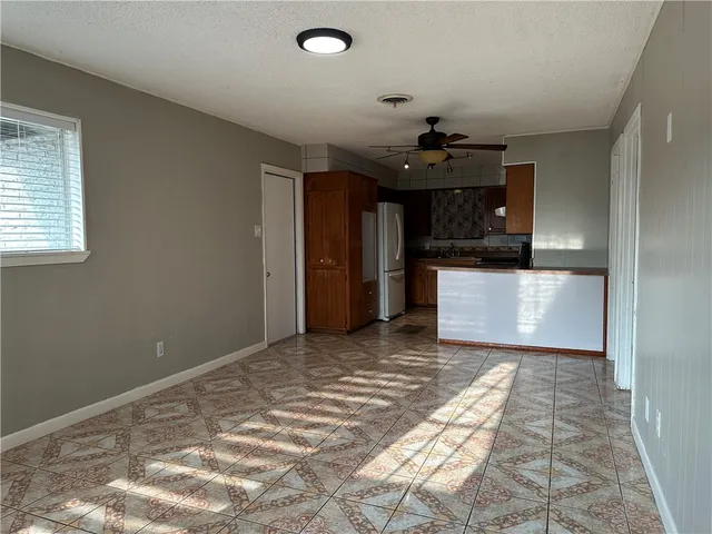 a view of a kitchen with a sink and a chandelier