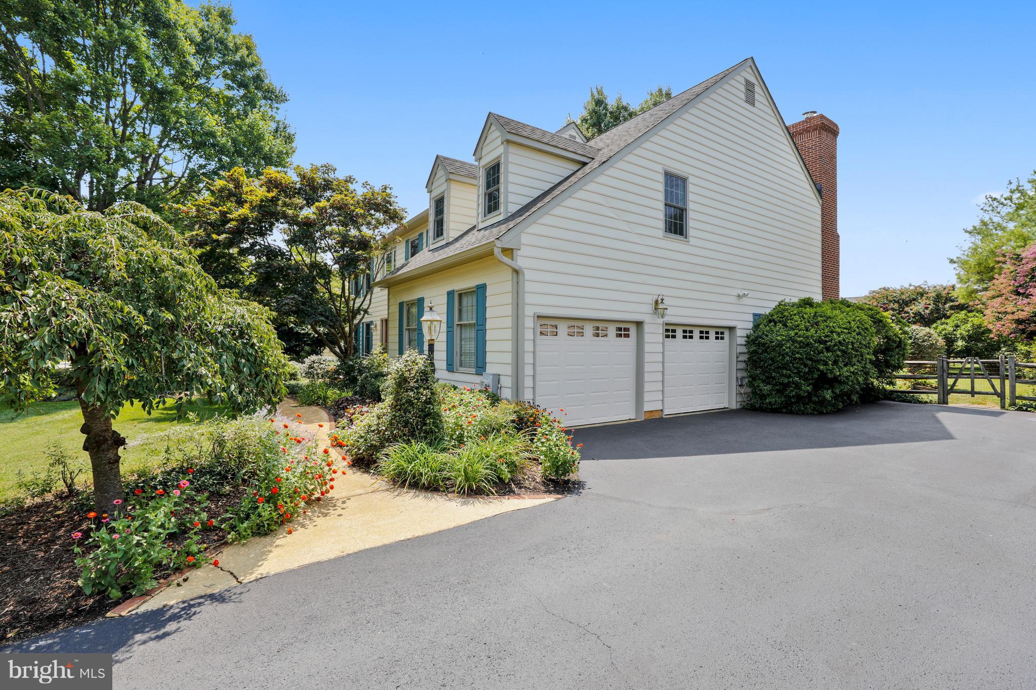 1476 Sharps Point Road Annapolis, MD 21409 - Photo 2 of 30 a view of a house with a yard and plants