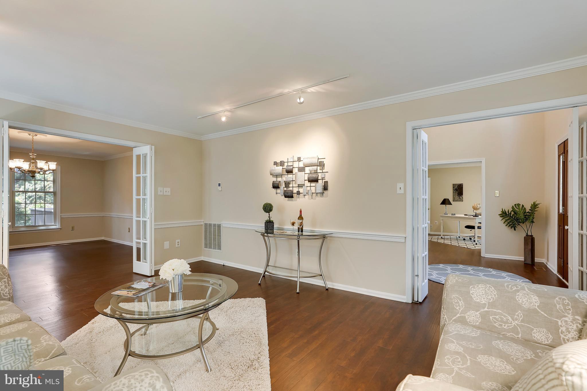 1476 Sharps Point Road Annapolis, MD 21409 - Photo 11 of 30 a living room with furniture and wooden floor
