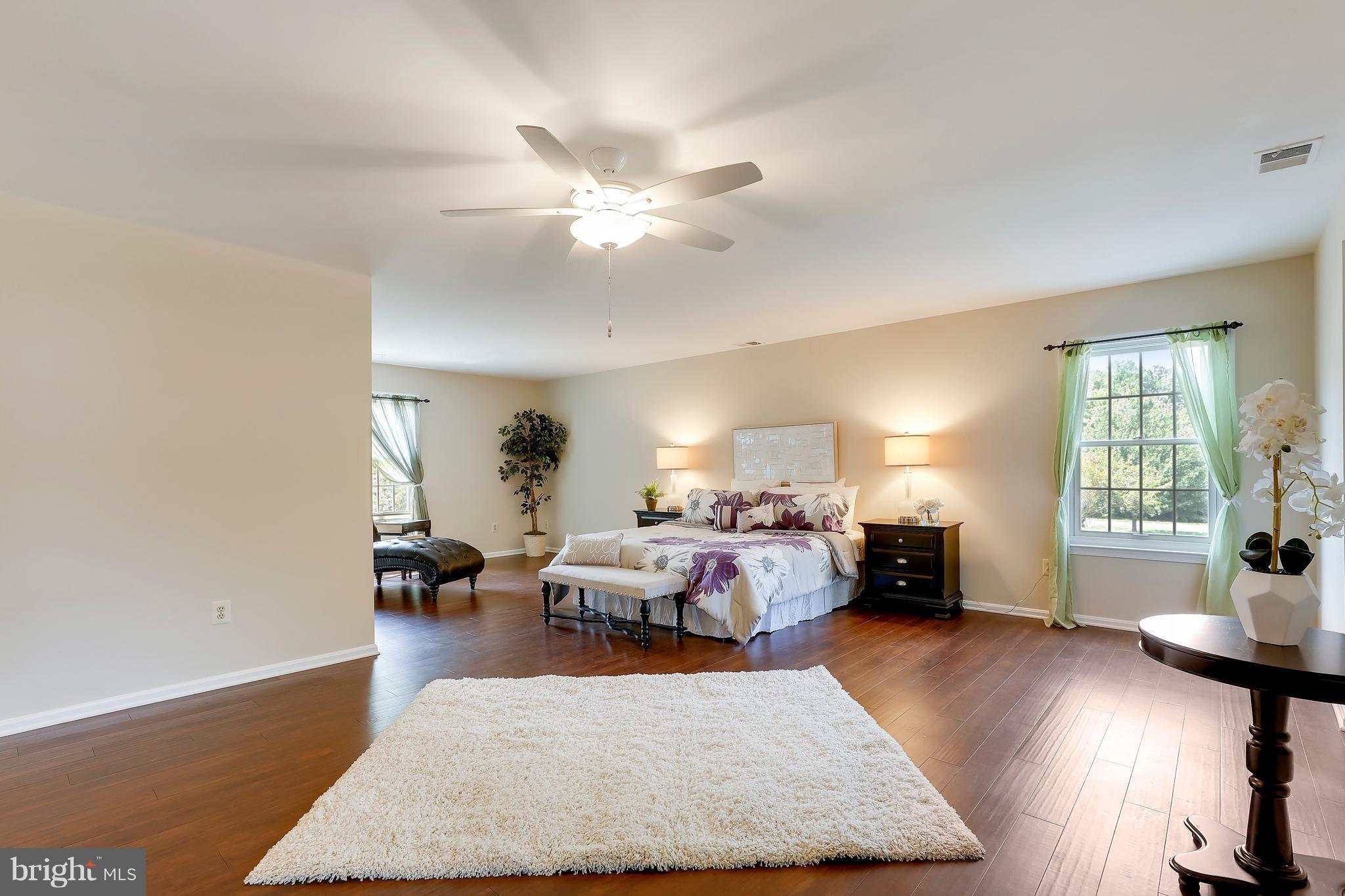 1476 Sharps Point Road Annapolis, MD 21409 - Photo 17 of 30 a living room with furniture and wooden floor