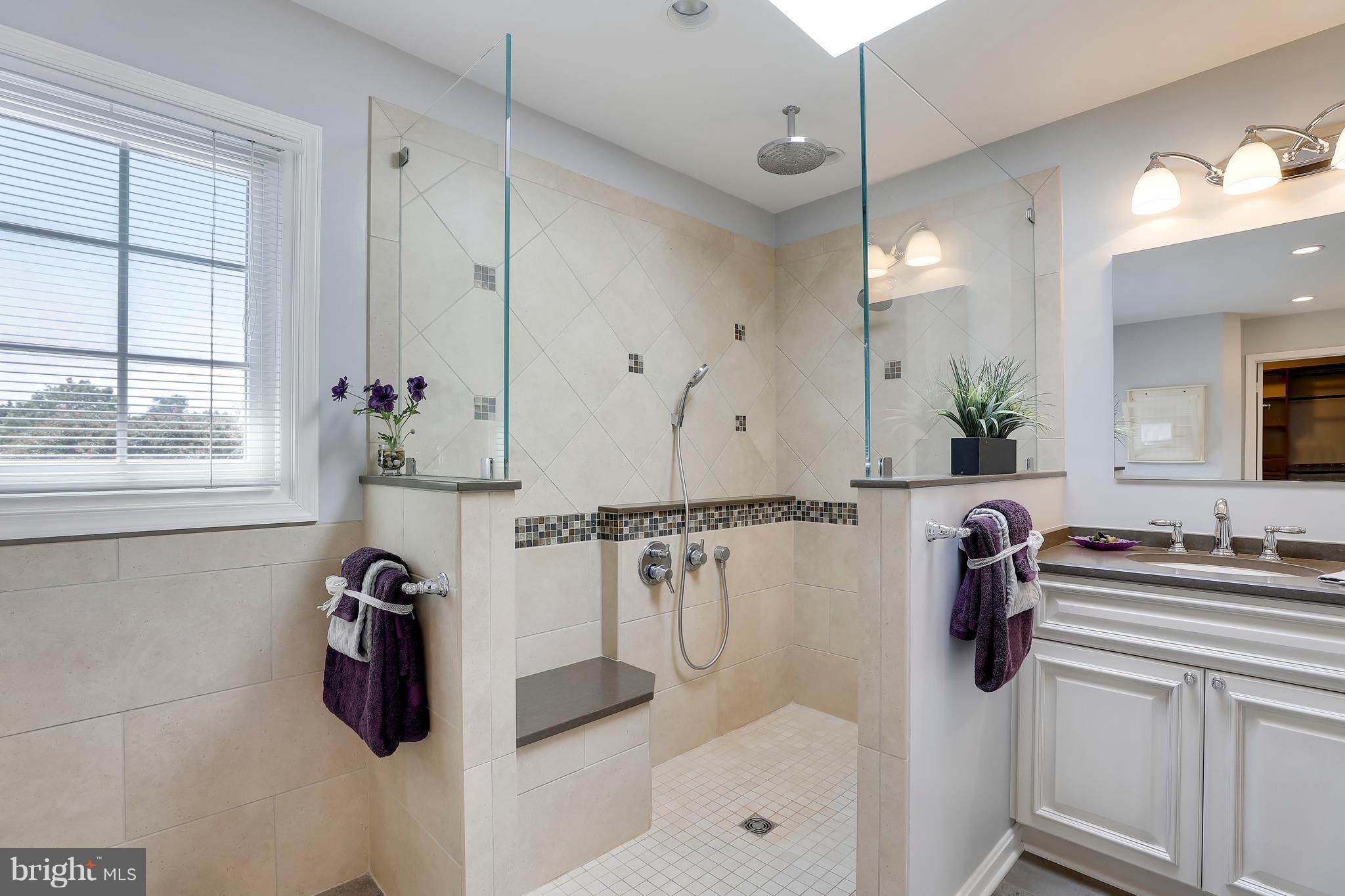 1476 Sharps Point Road Annapolis, MD 21409 - Photo 19 of 30 a bathroom with a tub sink and mirror