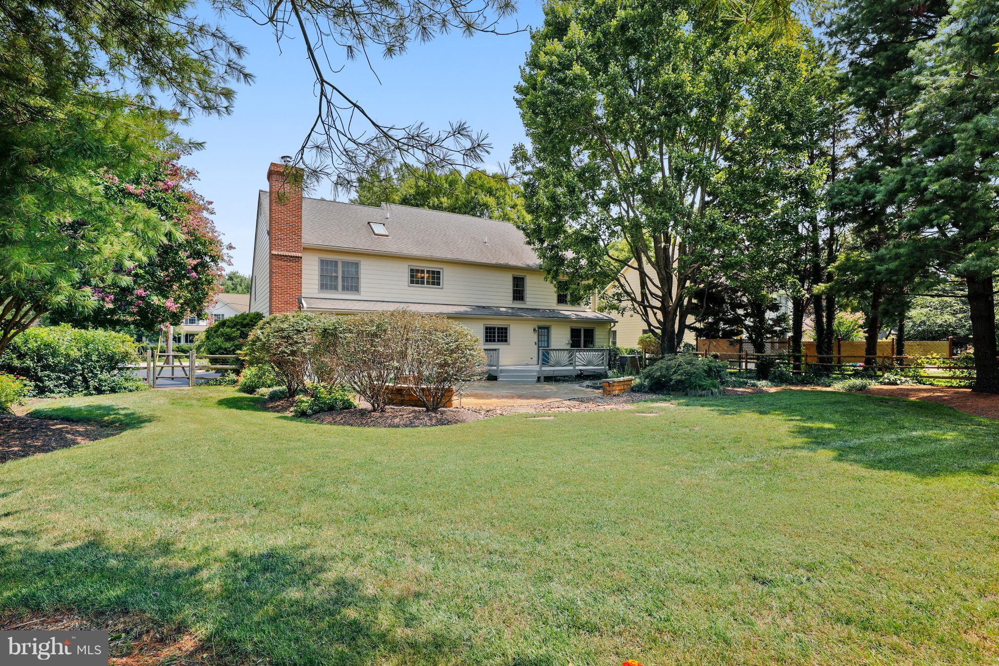 1476 Sharps Point Road Annapolis, MD 21409 - Photo 27 of 30 a view of a house with a big yard and large trees