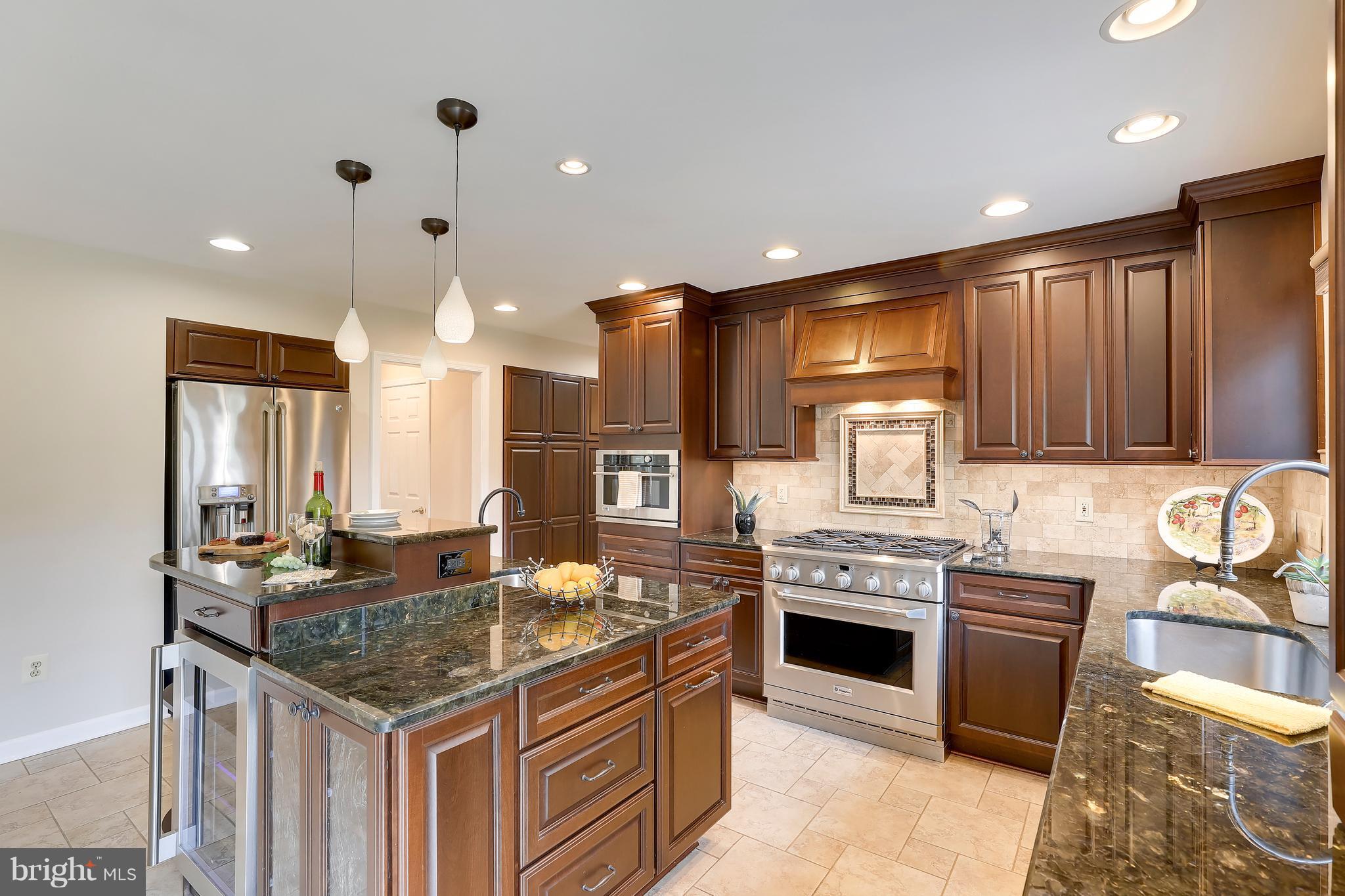 1476 Sharps Point Road Annapolis, MD 21409 - Photo 4 of 30 a kitchen with granite countertop a stove and a sink