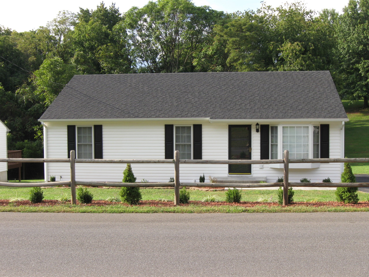 1116 Mountain View Road Vinton, VA 24179 - Photo 2 of 12 front view of house with a yard and a car park in front of it