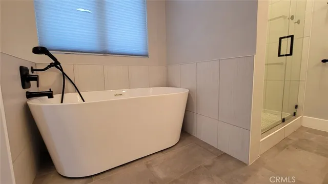 an entryway space with wooden floor and closet
