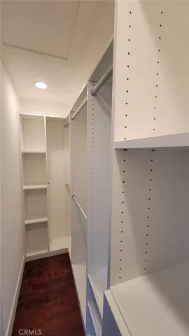 a large bathroom with a double vanity sink toilet and a mirror