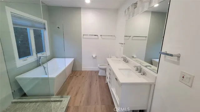 a bathroom with a bathtub and a shower