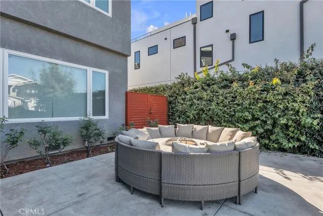 a white bench sitting in front of a building
