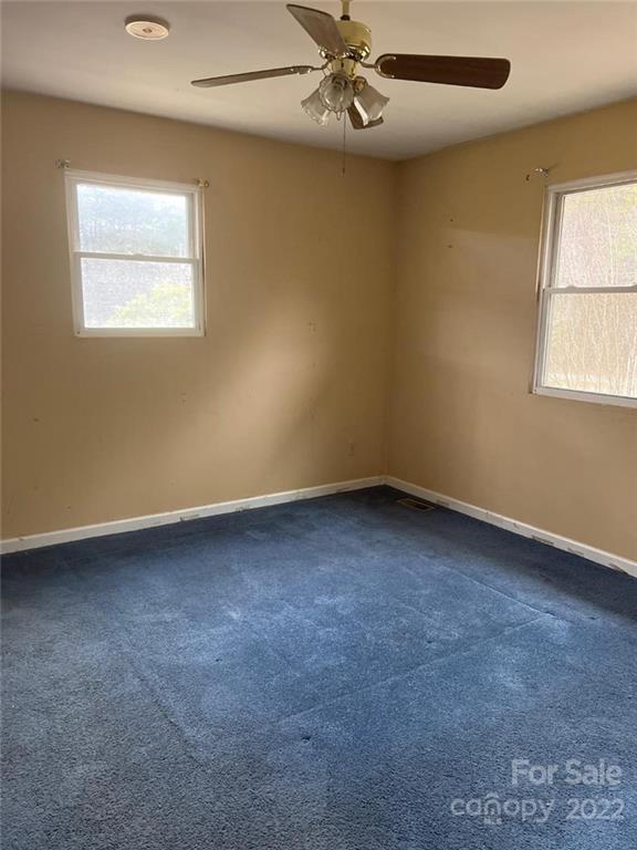 313 Old Barn Road Gold Hill, NC 28071 - Photo 6 of 9 an empty room with windows and fan