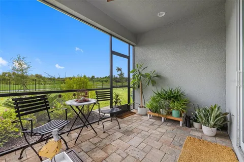 a view of a chairs and table in patio