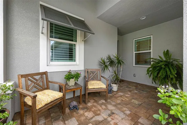 a house with a couch and potted plant