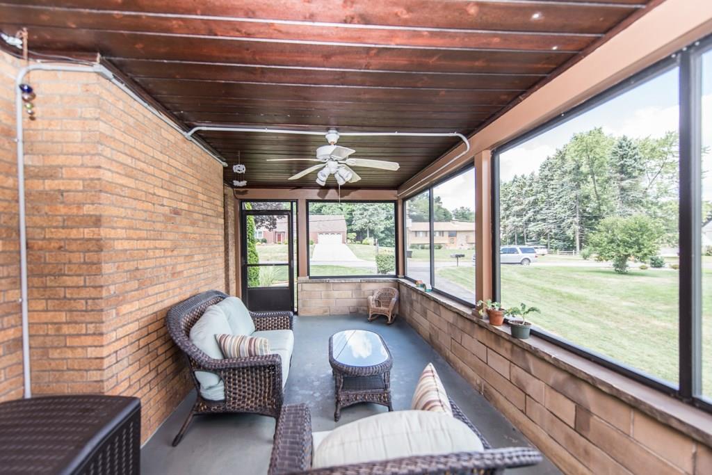 171 Pine Road Pittsburgh, PA 15237 - Photo 5 of 25 Step out of the living room onto the screened in side porch. It's light and breezy on a hot summer day.