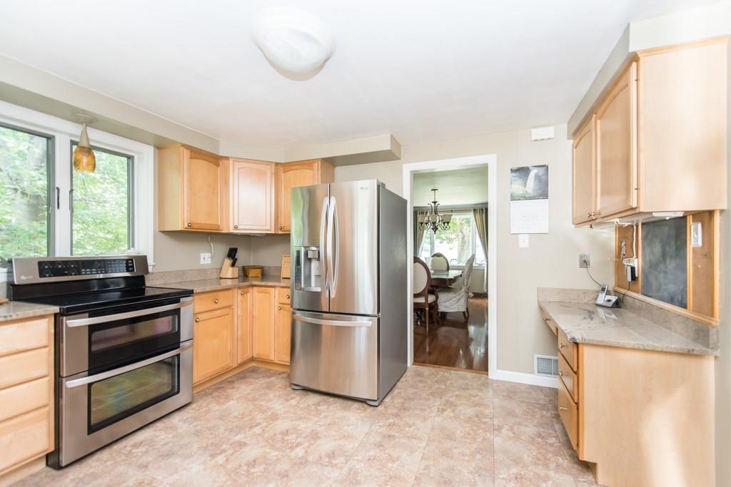 171 Pine Road Pittsburgh, PA 15237 - Photo 8 of 25 View of kitchen from Family Room. Maple cabinets, new granite counter tops, stainless steel appliances. Dining room is beyond the kitchen.