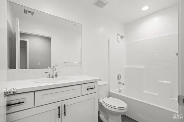 a view of storage and utility room with wooden floor