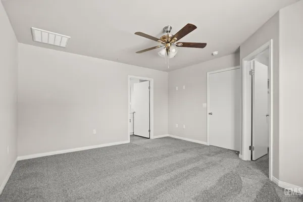 a bathroom with a double vanity sink toilet mirror and bathtub